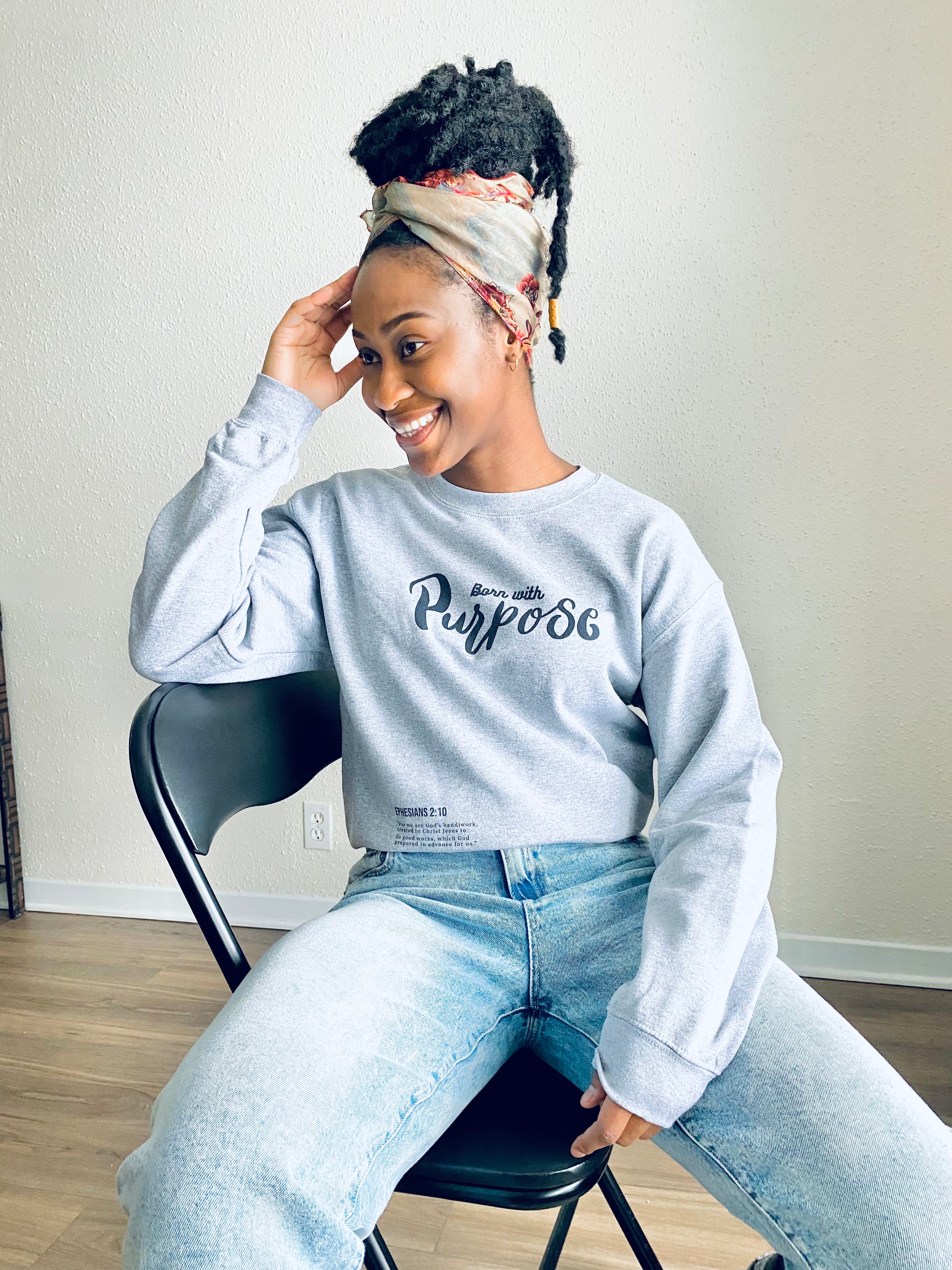 Our lovely grey crew neck that says "Born with Purpose". this is a message to everyone encouraging them to never give up on life, they are here for a reason, not by mistake.